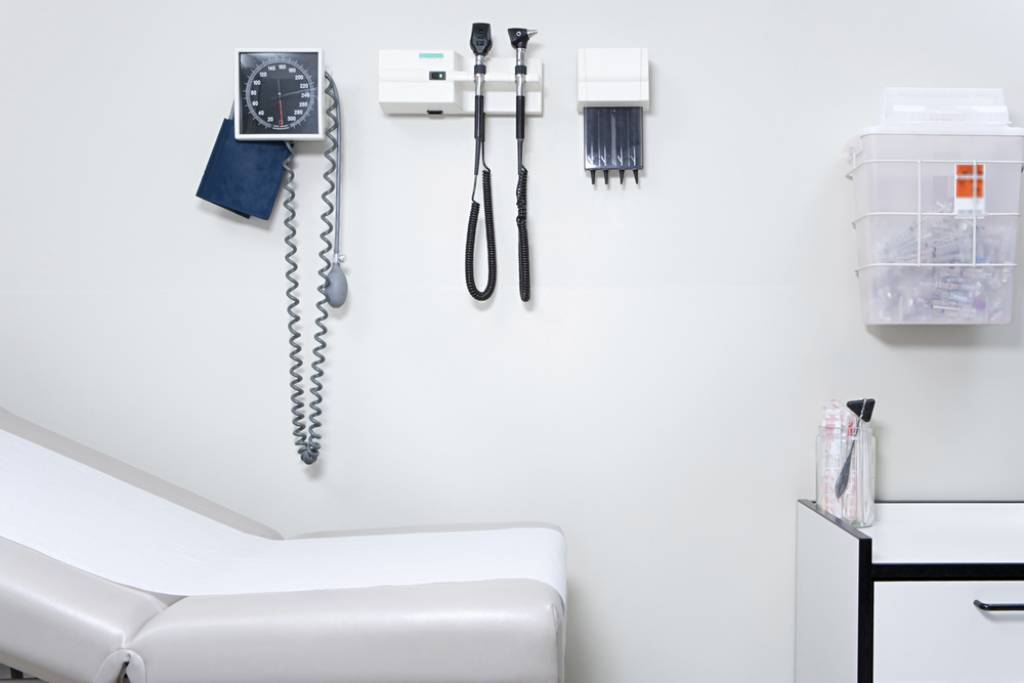 Crisp white exam room with an efficient layout