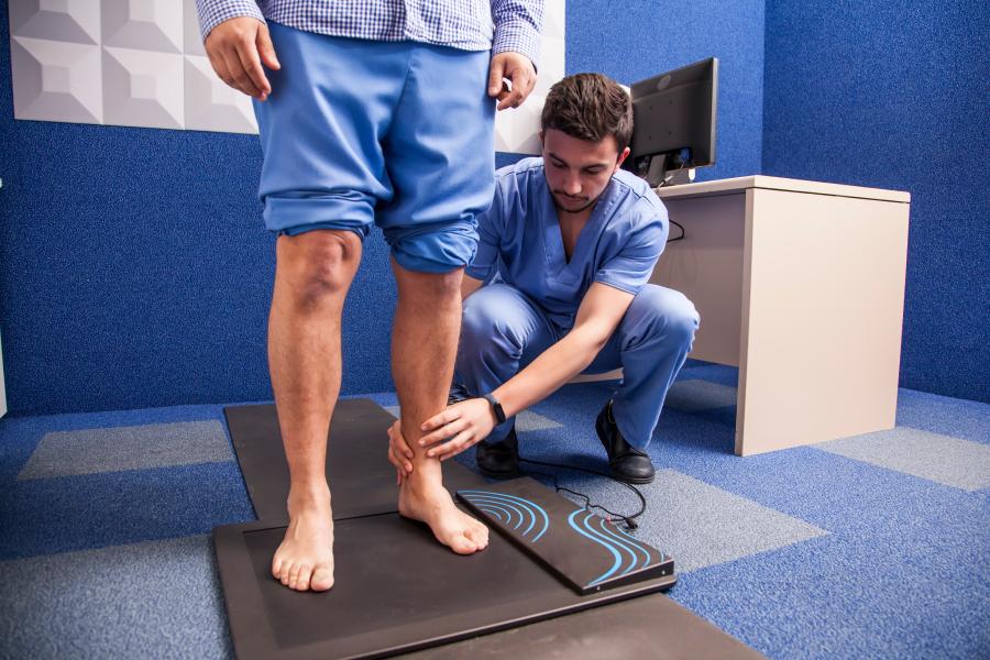 Patient being treated at podiatry clinic by male doctor